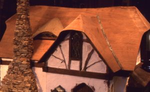 The Elmer's painted over the eyebrow gives it that white color, and you can see the score marks in the ply over the eave end. The flashing in the gutters is rolled-out and aged wine bottle lead.